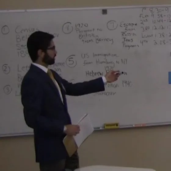 Grant teaching at a whiteboard during student teaching at Marvin Ridge High School